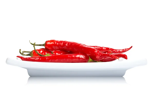 Red peppers in the dish — Stock Photo, Image