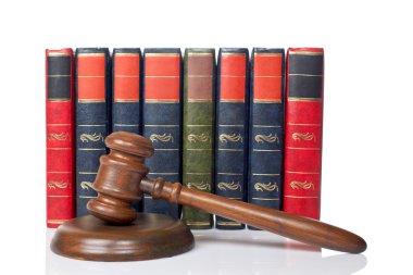 Wooden gavel and old law books clipart