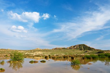 Hill over the blue sky and the lake clipart