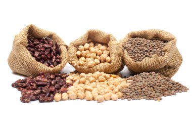 Lentils, chickpeas and red beans spilling out clipart