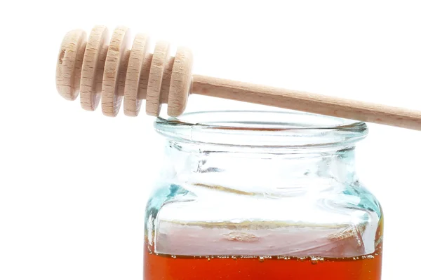 Méz jar és fából készült drizzler — Stock Fotó