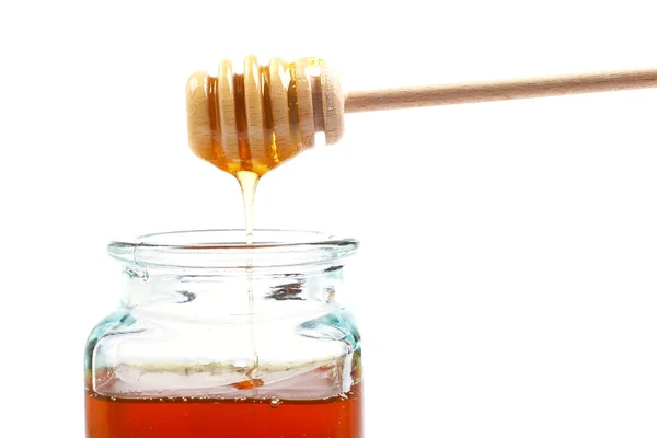 Gieten van honing — Stockfoto