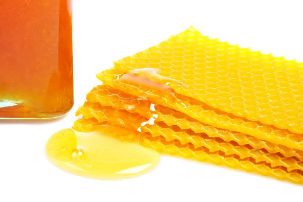 Honingraat met honing en jar — Stockfoto