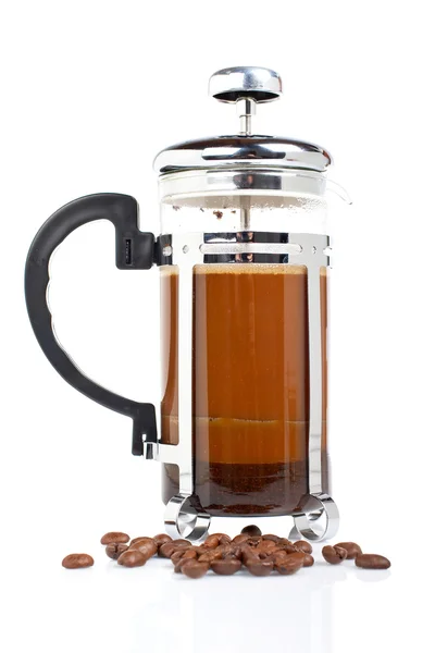 Eine Kaffeekanne mit Bohnen — Stockfoto