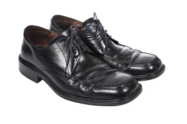 Используемые черные туфли — стоковое фото