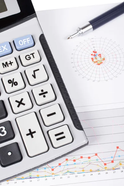 Calculator and pen on earnings chart — Stock Photo, Image