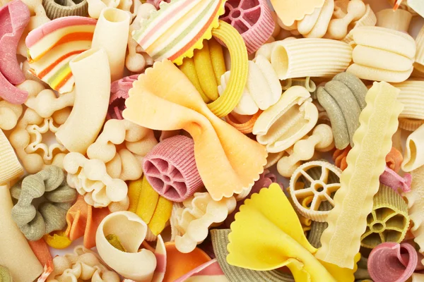 Uncooked pasta background — Stock Photo, Image