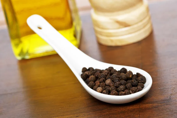 Peppercorns in the spoon — Stock Photo, Image