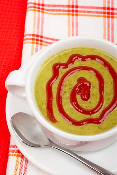 Spinach puree over squared mat — Stock Photo, Image
