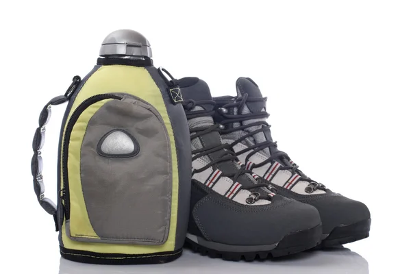 Hiking boots and canteen — Stock Photo, Image