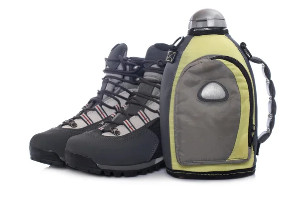Hiking boots and canteen — Stock Photo, Image