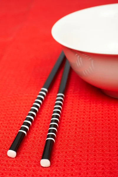 Pair of chopsticks and white bowl — Stock Photo, Image
