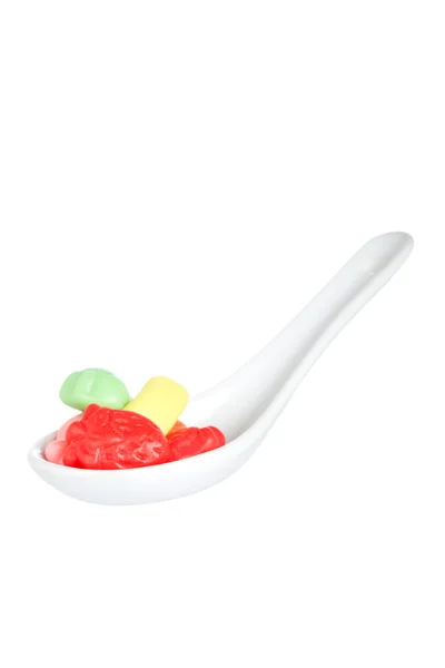 Candies in the spoon — Stock Photo, Image