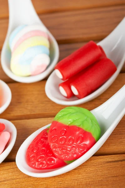 Candies in the spoons — Stock Photo, Image