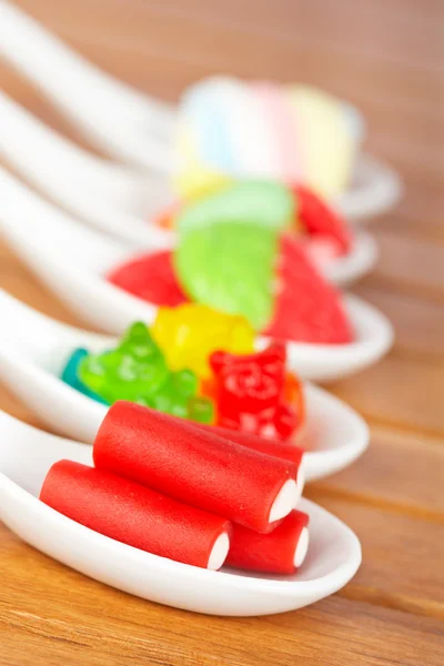 Candies in the spoons — Stock Photo, Image