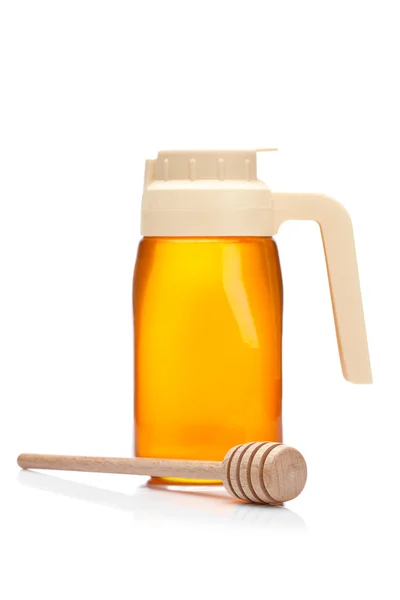 Džbánek medu a dřevěné drizzler — Stock fotografie