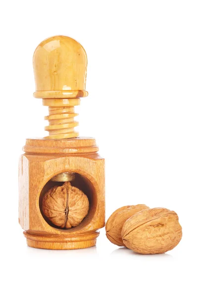 Волоські горіхи і дерев'яний лускунчик — стокове фото
