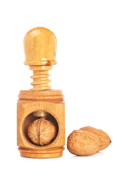 Walnuts and wood nutcracker — Stock Photo, Image
