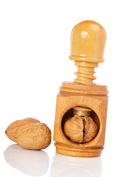 Walnuts and wood nutcracker — Stock Photo, Image