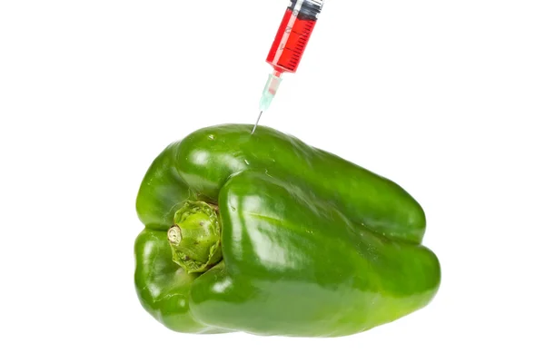 Green pepper with syringe inserted — Stock Photo, Image