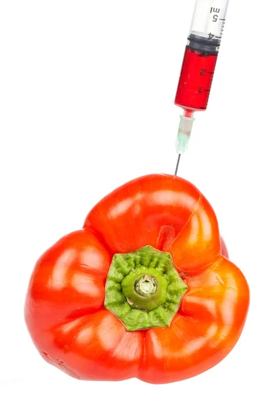 Red pepper with syringe inserted — Stock Photo, Image