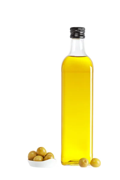 Пляшка оливкової олії та трохи оливок — стокове фото