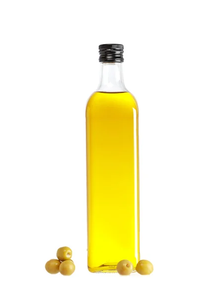 Olive oil bottle and some olives — Stock Photo, Image