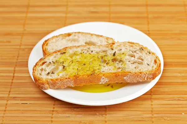 Slices of bread with olive oil — Stock Photo, Image