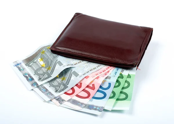 Old leather wallet with bills inside — Stock Photo, Image