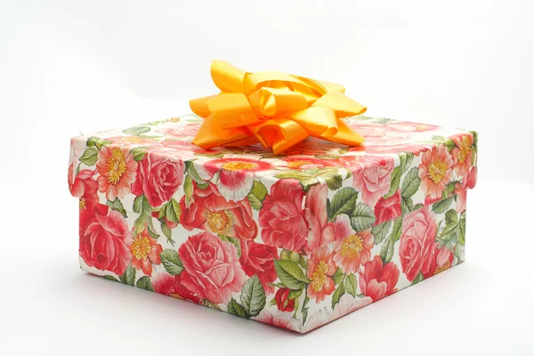 Gift box with yellow ribbon — Stock Photo, Image