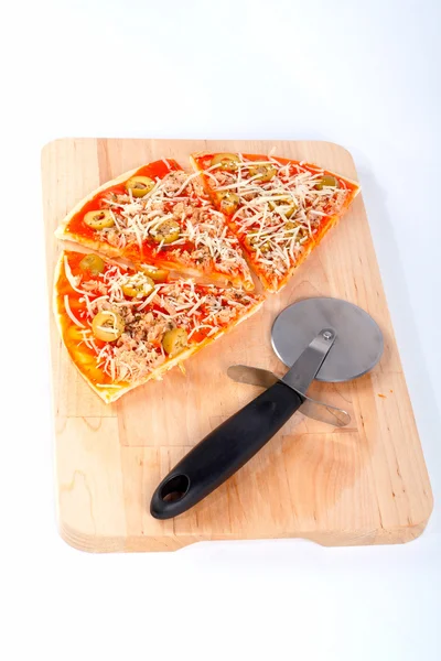 Slices of Italian pizza and cutter — Stock Photo, Image