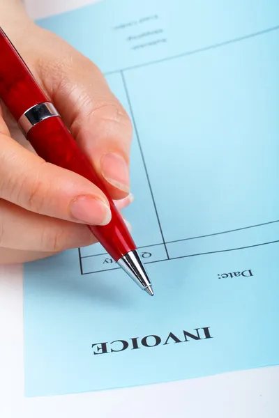 Writing blank invoice with pen — Stock Photo, Image