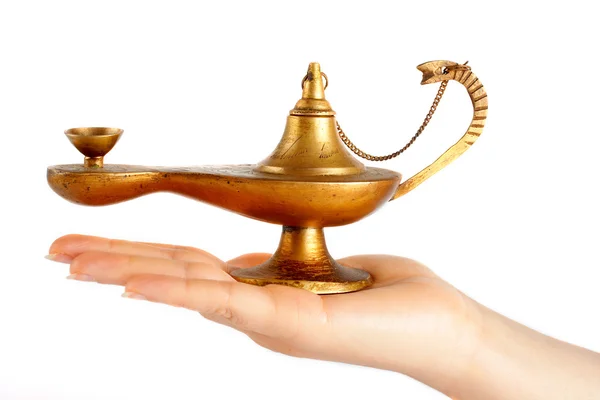 Old brass oil lamp on the hand — Stock Photo, Image