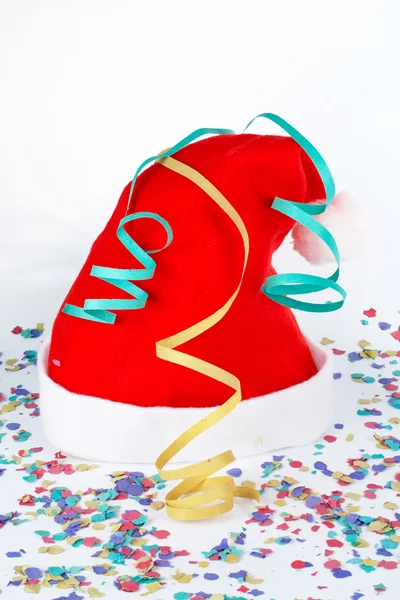 Christmas hat with ribbons and confetti — Stock Photo, Image