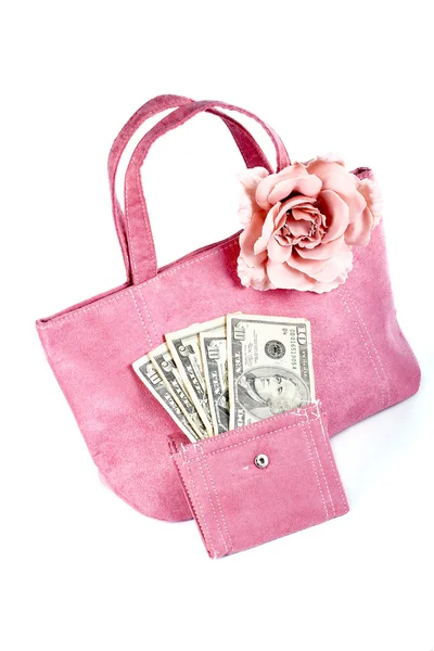 Roze handtas met geld op witte achtergrond — Stockfoto