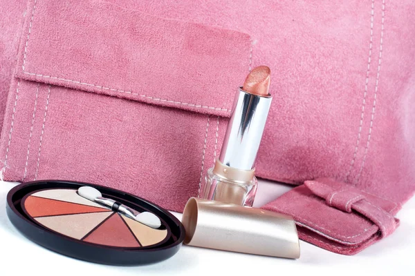 Detail of lipstick and Assortment of pink handbags — Stock Photo, Image