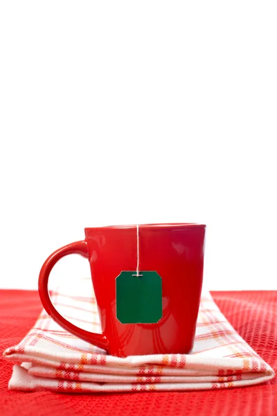 Röd kopp med te-påse — Stockfoto