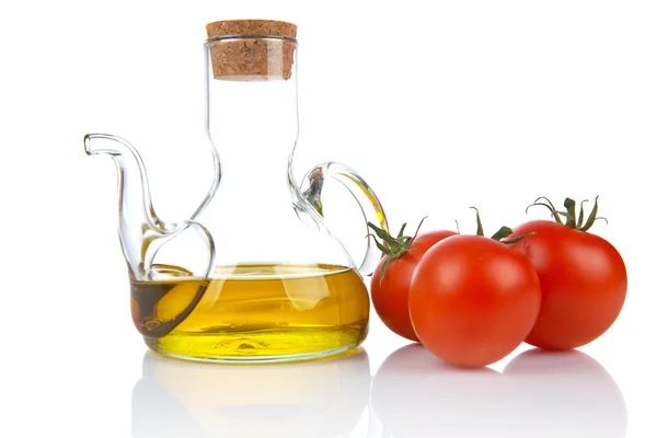Tomaten en oilcan — Stockfoto