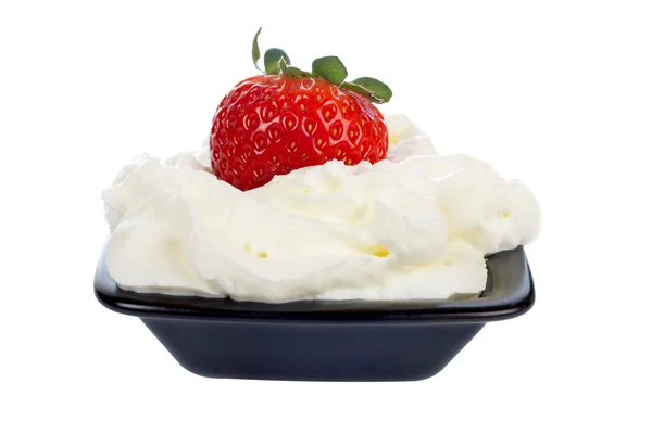 Strawberry over a cream — Stock Photo, Image