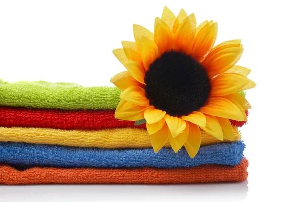 Artificial flower on towels — Stock Photo, Image