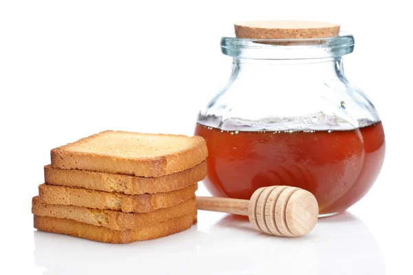 Honigglas und Toastbrot Stockbild