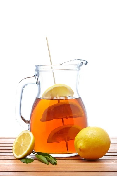 Ice tea with lemon pitcher Royalty Free Stock Images