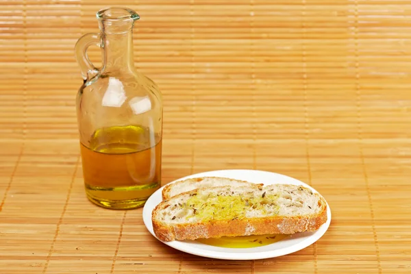 Sneetjes brood met olijfolie Stockfoto