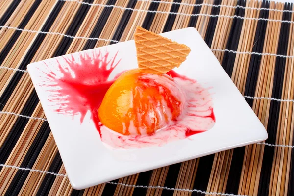 Dessert with peach, cracker and cream Stock Photo