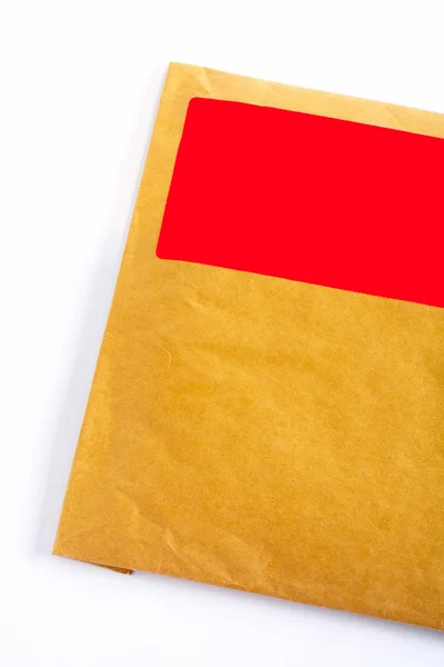 Detalj av kuvert med tomt rött klistermärke Stockbild