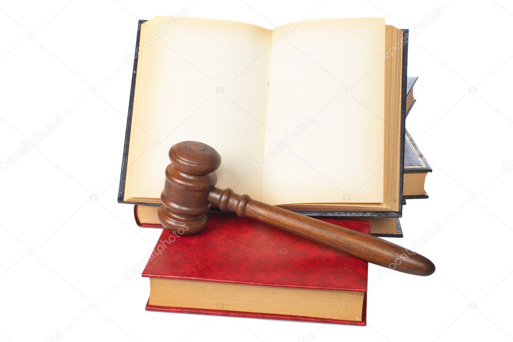 Wooden gavel and old opened law book