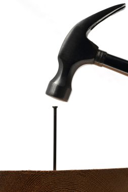 A hammer hitting a nail clipart