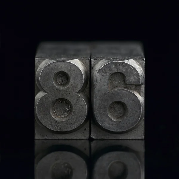 stock image Lead letters numbers 86