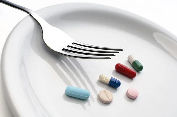 En måltid med piller — Stockfoto