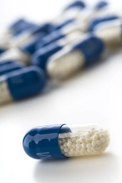Blauwe capsules Stockfoto